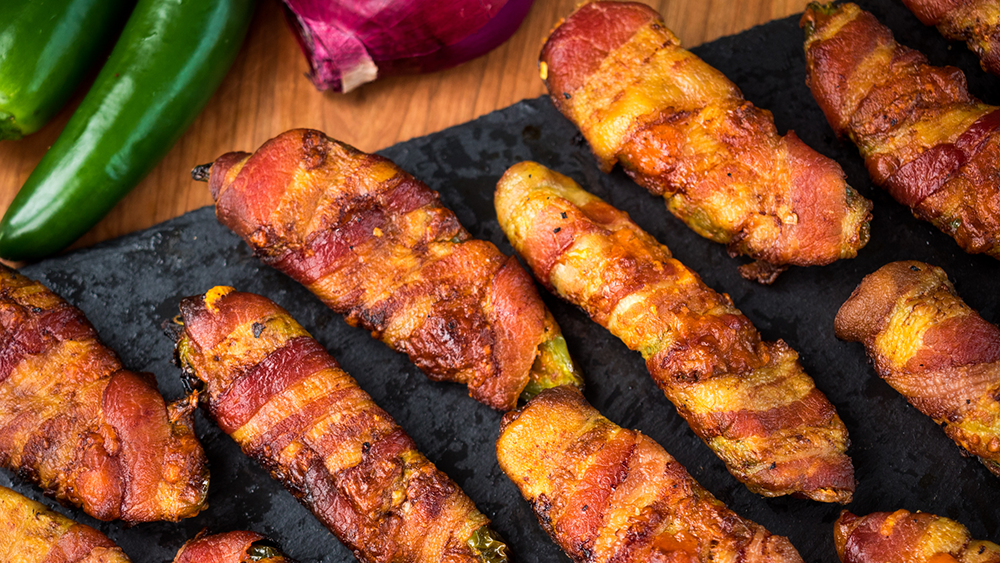 Chili stuffed bacon wrapped jalapeno poppers